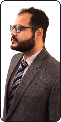 Hassan Kamran, confidently posing in business attire with a professional and approachable expression.